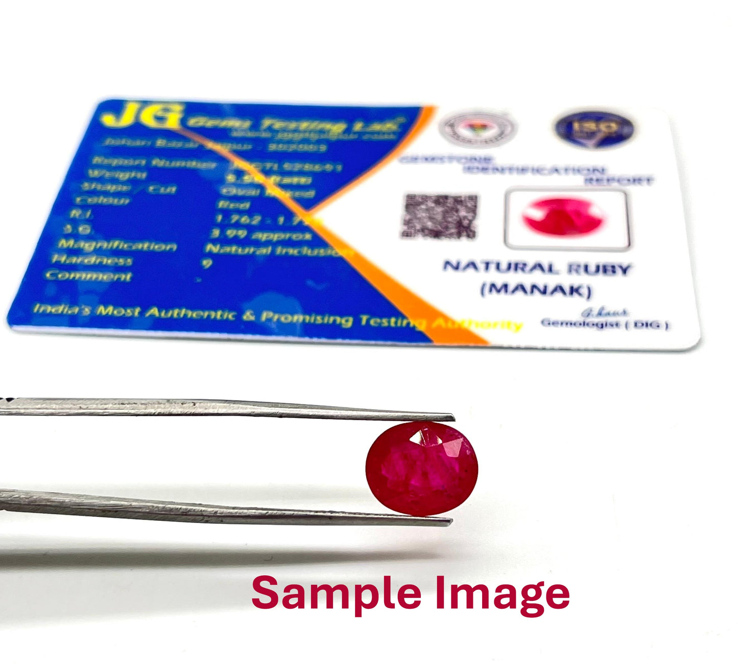 Ruby gemstone on a stand with a certification label in the background