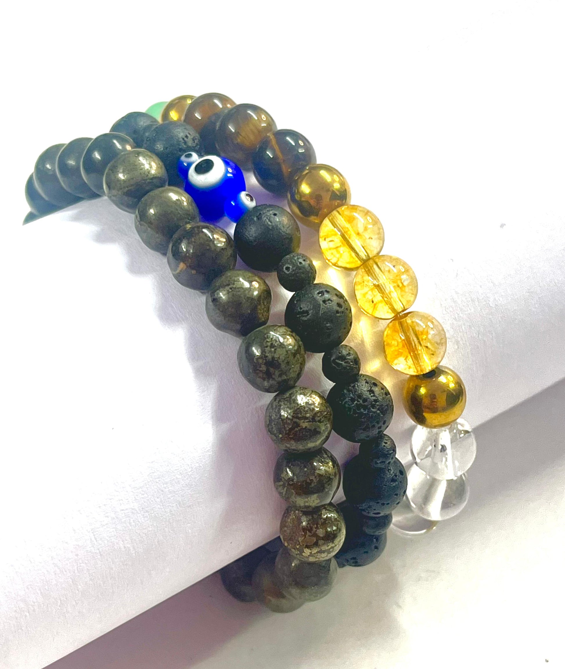 Complete wealth attraction bracelet set with pyrite lava stone and evil eye protection