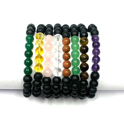 Set of beaded bracelets in various colors on a white background